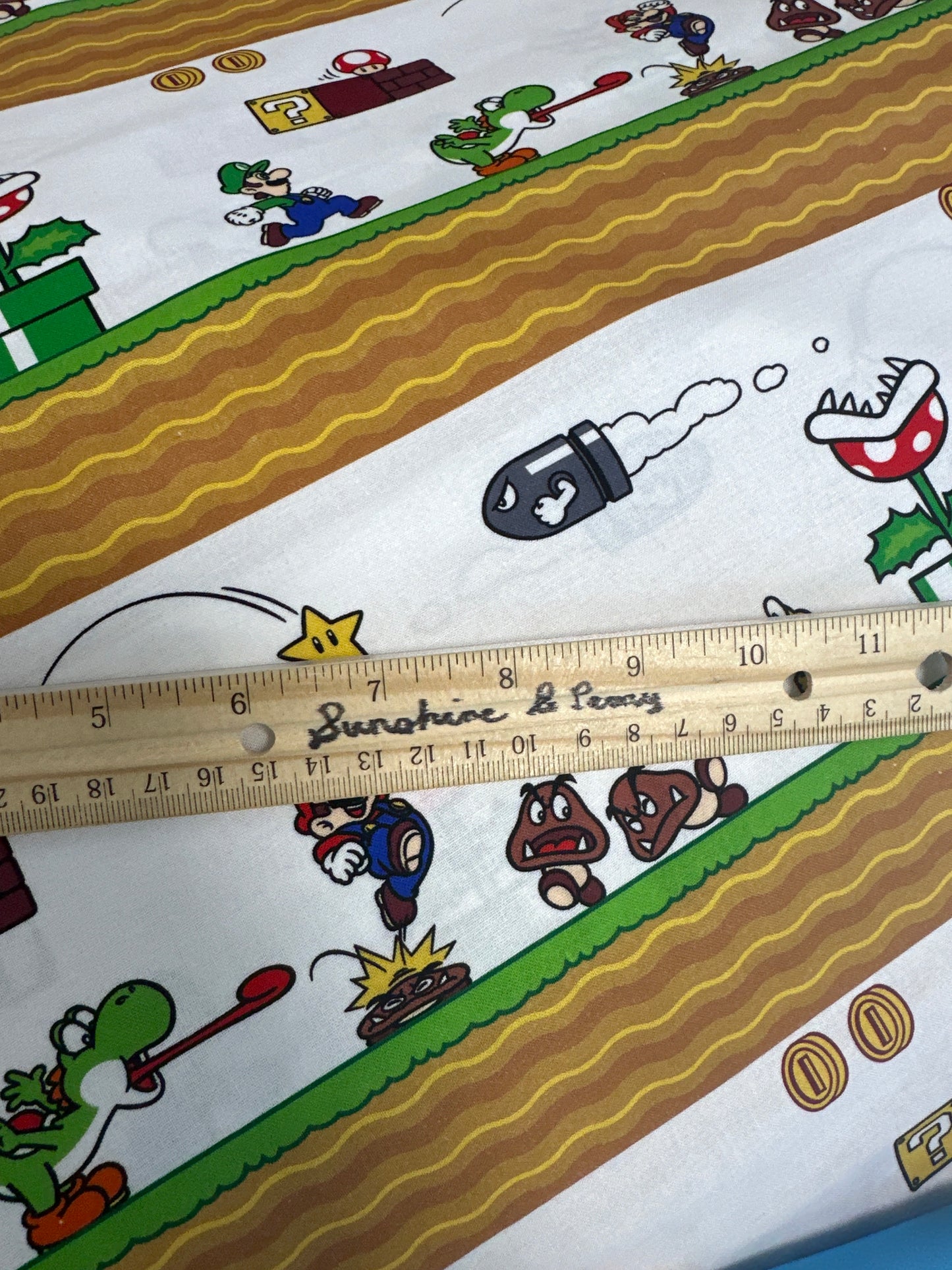 Springs Creative - Nintendo - Super Mario Side Scroller - Priced per half metre