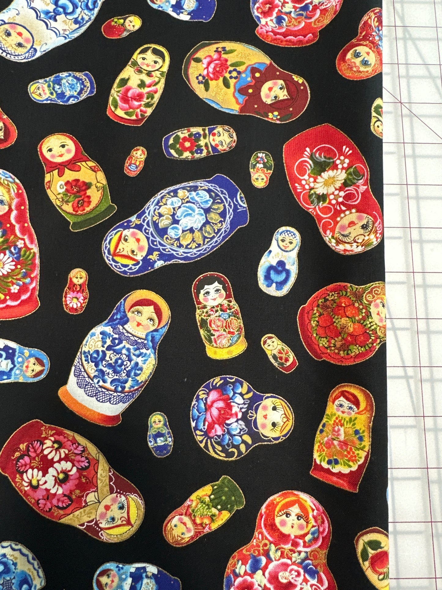 Matryoshka - Tossed Dolls Metallic Black from Elizabeth’s Studio Fabric