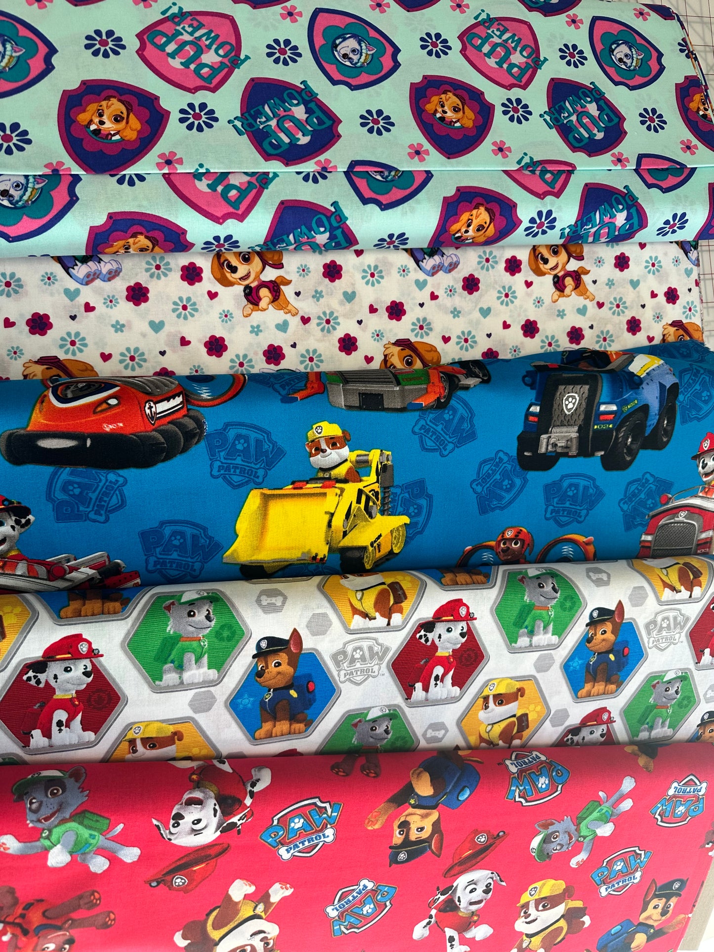 Paw Patrol by David Textiles - Paw Patrol Pup Power - White/Multi  - Priced per half metre