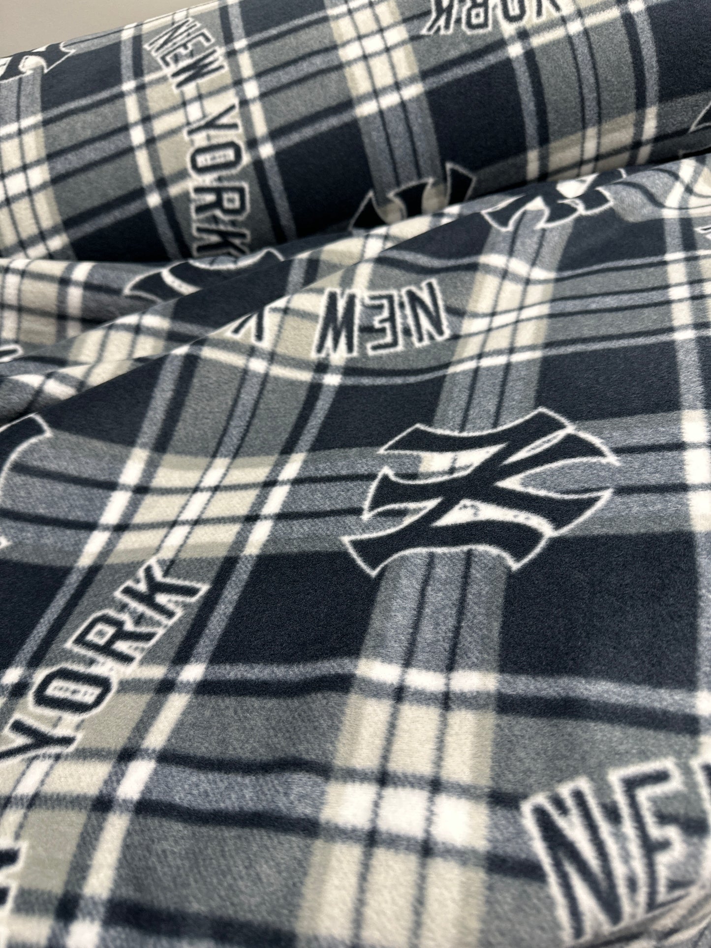Last approx 35 “ x width of fabric - Fleece - New York Yankees - Blue and White Plaid