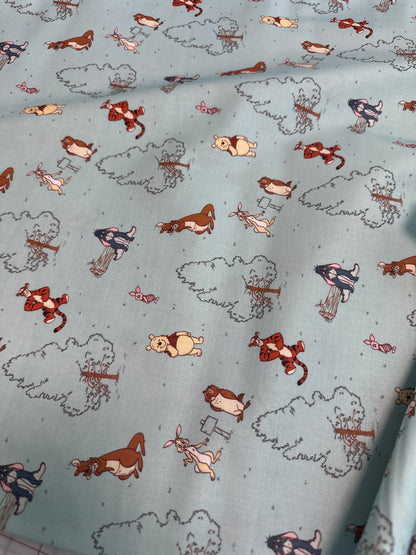 Disney - Springs Creative - Winnie the Pooh - Classic Characters on Light Green - Priced by the Half Metre